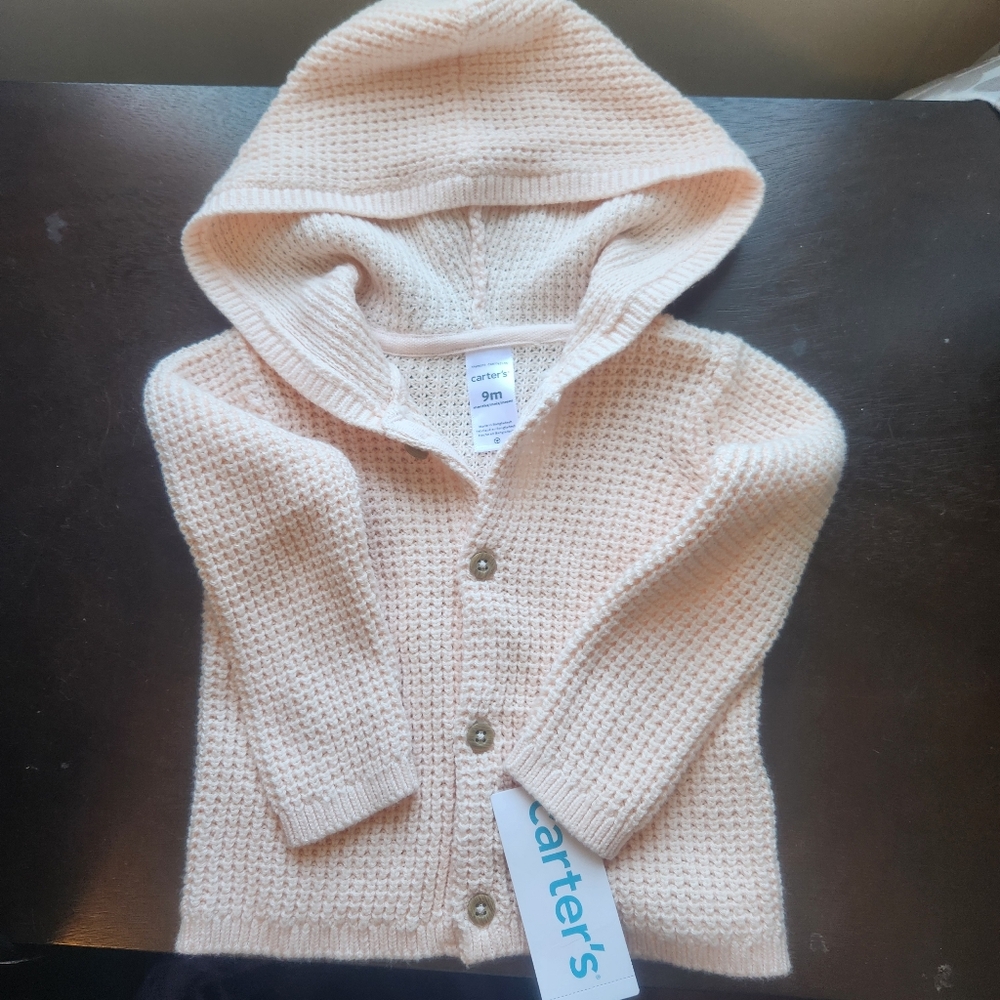 Carters Baby girls cardigan 9 months.  New with tags.